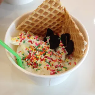 Mango an cheesecake yogurt with Oreos, sprinkles, and waffle cones