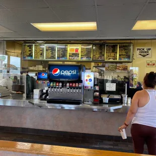 a woman standing at the counter