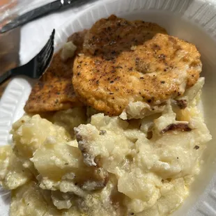 Grilled seasoned chicken cutlets with potatoes