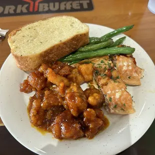 General Tso's Chicken,  Sweet and Sour Chicken, green beans, garlic bread, salmon