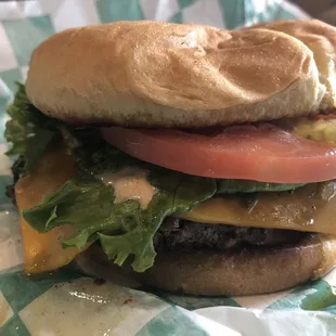 Single burger with cheddar, signature sauce, lettuce, tomato, pickles, grilled onions and grilled jalapeños. So good!
