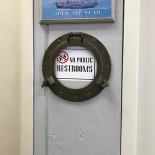 After sitting there for 10 minutes thinking it was just occupied I noticed this little sign hiding away.