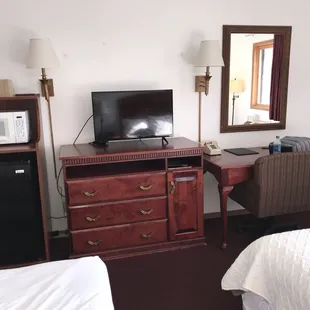 Good size fridge, microwave and dresser, desk.