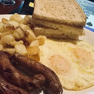 Breakfast with sausage, sourdough, eggs and potatoes