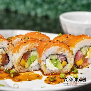 a plate of sushi rolls