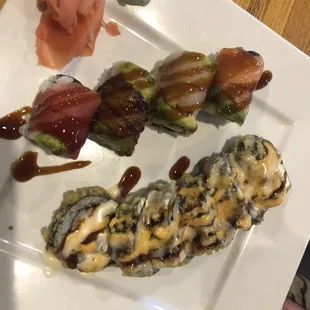 a plate of sushi with a variety of toppings