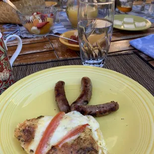 Mexican frittata, sausage, bread with jam &amp; butter, and a fruit starter. Orange juice, coffee, and English tea offered.