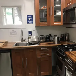 New kitchen sink, 2 dishwasher 3 ovens in this picture alone.