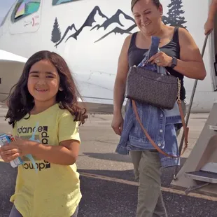 Exiting happy after their flight.