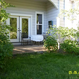 the main house with a charming patio