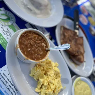 Honey ham, Portuguese beans , Scrambled eggs with holiday sauce on the side, biscuit w/gravy