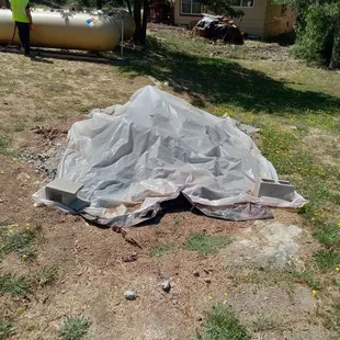 The "fix" for the septic system. Cover it with plastic and just run the turds through the bushes.