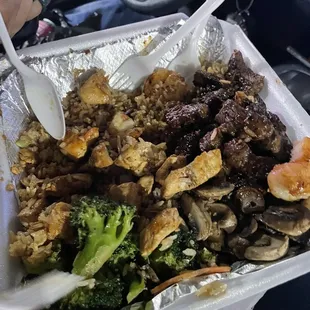 Hibachi combo chicken shrimp steak with fried veggie rice broccoli and mushrooms