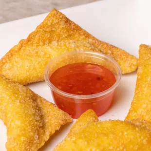 a plate of food with a bowl of ketchup