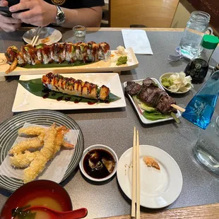Shrimp Tempura Appetizer, Lion King Roll, Dancing Dragon Roll, Miso Soup, Beef Skewer, Sake