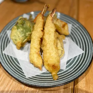 a plate of food on a wooden table