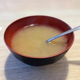 a bowl of soup with a spoon