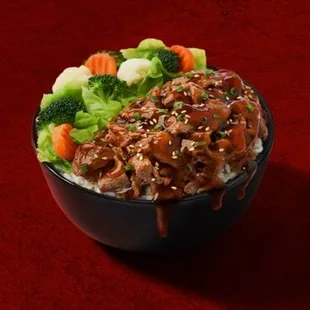 a bowl of rice with meat and vegetables