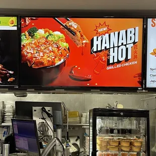 a restaurant counter with a variety of food items
