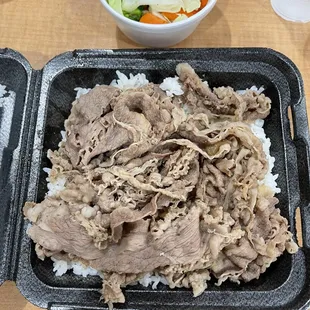 a meal in a styrofoam container