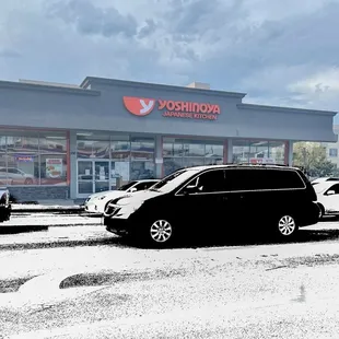 cars parked in front of a store