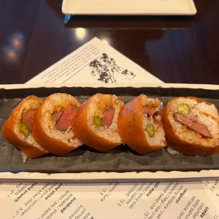 a plate of sushi rolls