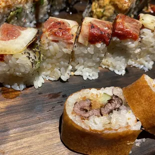 a sushi roll with meat and vegetables