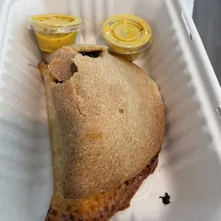 Mushroom empanada on top of a chicken empanada
