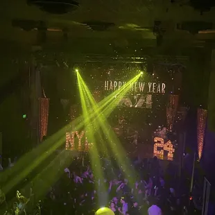 a crowd of people at a new year's eve party