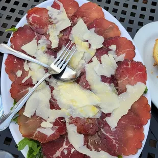 Thinly sliced dried beef with cheese and a light coating of lemon on top. Yummy