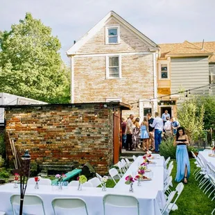 a group of people gathered outside a house