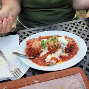 3 huge meatballs with red sauce!