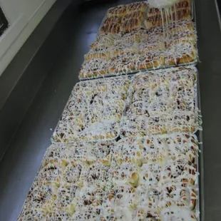 Cinnamon Buns getting their fresh whipped icing.