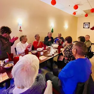 a group of people sitting around a table