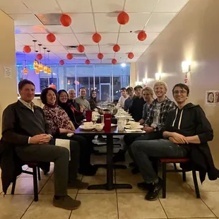 a group of people sitting at a table