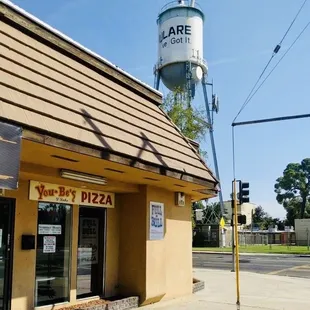 Located across from the glass of milk.