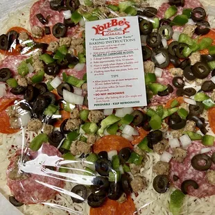 ows a pizza wrapped in plastic