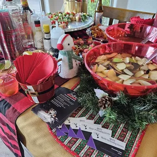 Batched themed cocktails for Christmas in July. Spiced apple bourbon punch and white sangria with apple brandy, cinnamon sticks