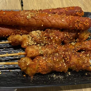 Ham sausage and chicken skewers.