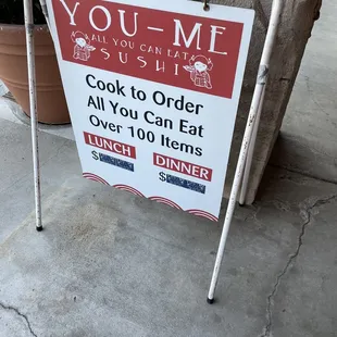 a sign on the sidewalk
