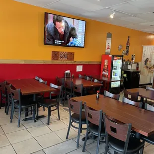 a restaurant with tables and chairs