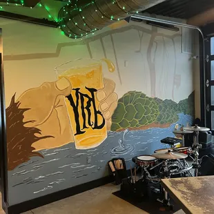 a mural of a beer and a drum