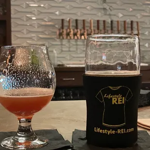 a glass and a bottle on a table