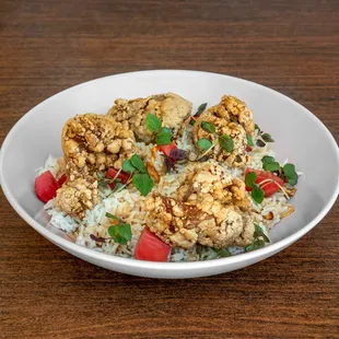 Popcorn Fried Chicken Bowl - Battered and fried chicken in sweet potato flour served over sesame garlic fried rice, with yuzu shoyu sauce