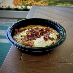 The South In A Bowl (grits, crispy bacon, cheddar cheese, eggs)