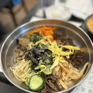 a bowl of noodles and vegetables