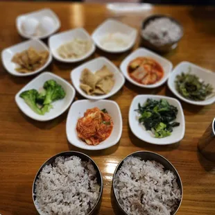 a variety of small bowls of food