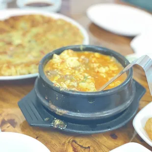 a bowl of soup and a plate of food