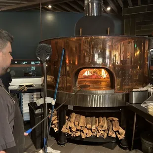 Italian fire oven.  Red Oak is the choice of wood.