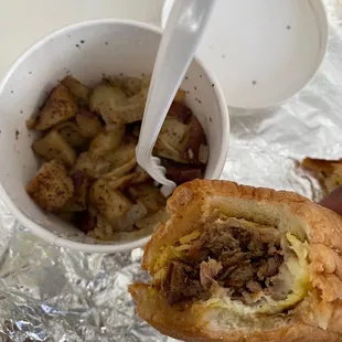 Steak and egg sub with home fries... home fries are actually RED potatoes with onions of course!